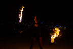 Fire poi with black braided cords and two burning flame ends