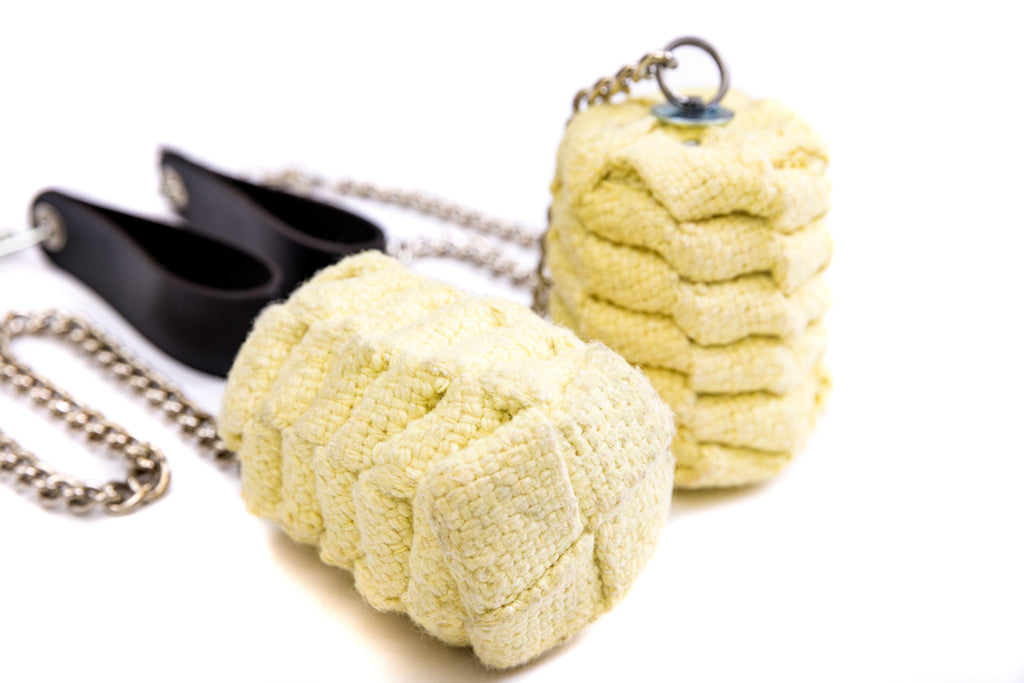 Fire poi set with yellow sponge poi heads on silver chains and black handle