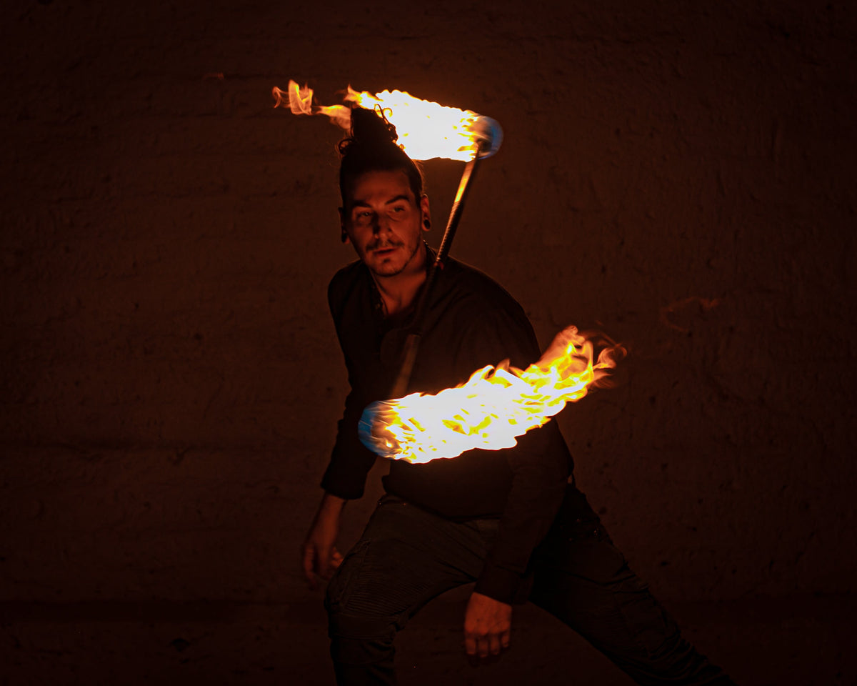 Fire staff with multiple burning wicks along the pole ends