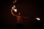 Fire staff with burning wick ends at both sides