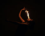 Handheld fire torch with flame at the tan woven head