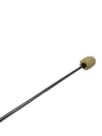 Close view of a fire torch: tan woven head on a black metal rod