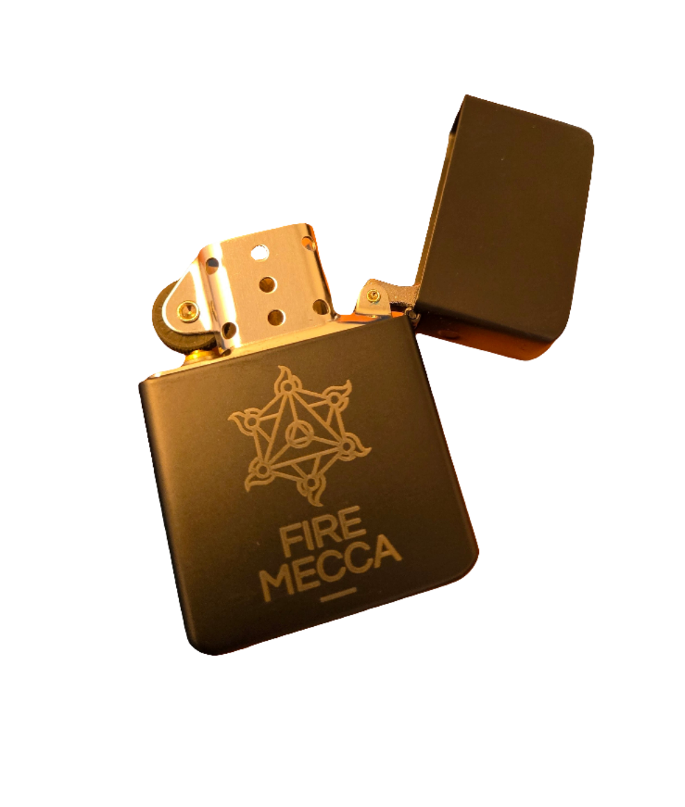 Matte black engraved lighter with ornate Fire Mecca emblem and open metal top