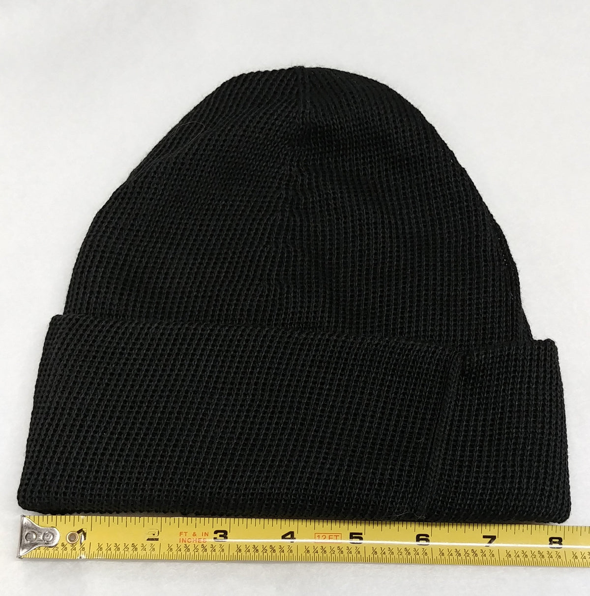 Black kevlar knit beanie, ribbed texture with size measurement