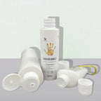 Liquid magnesium grip bottles with white pump tops and golden handprint graphics