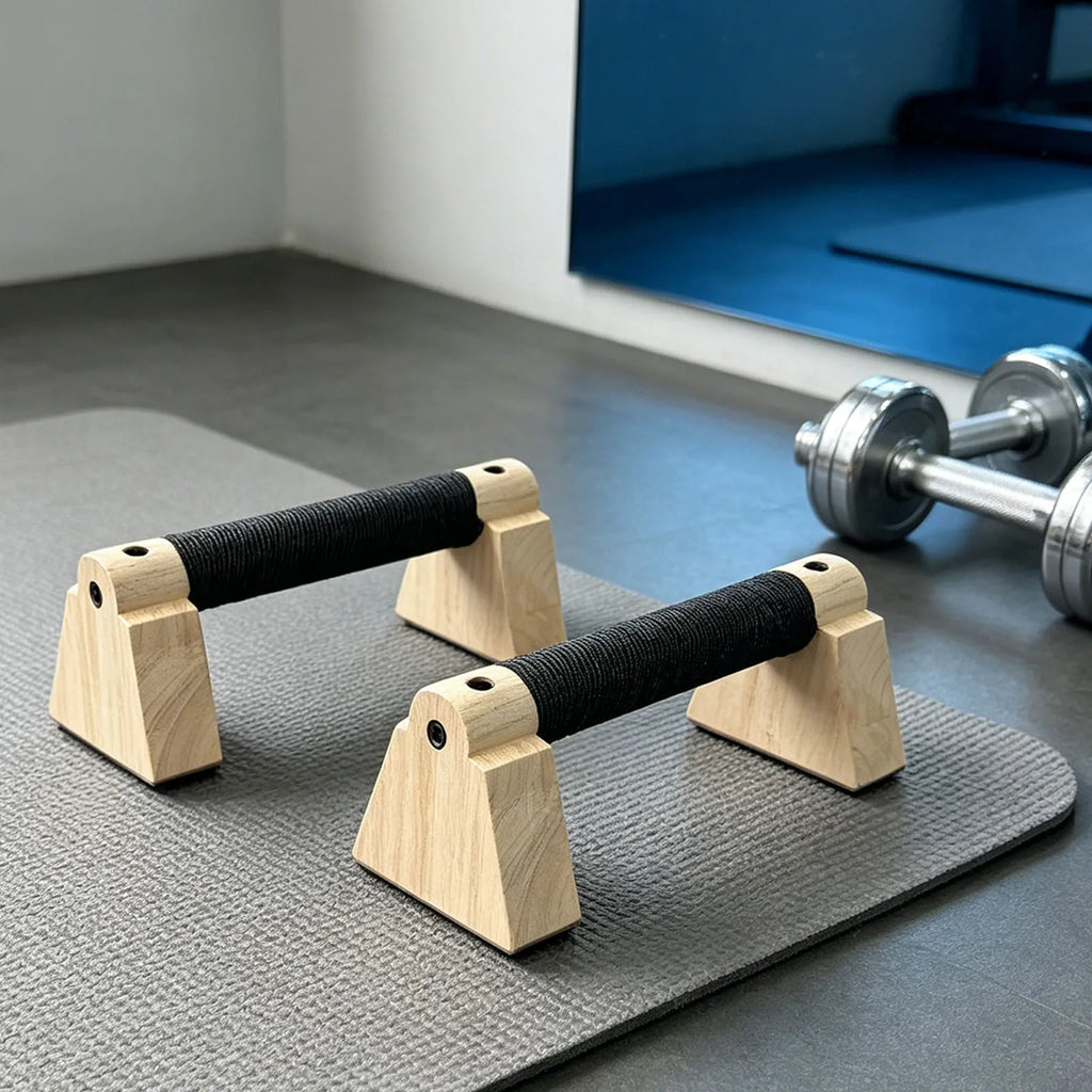 Set of wooden parallettes with black grip handles and stable arched wooden bases