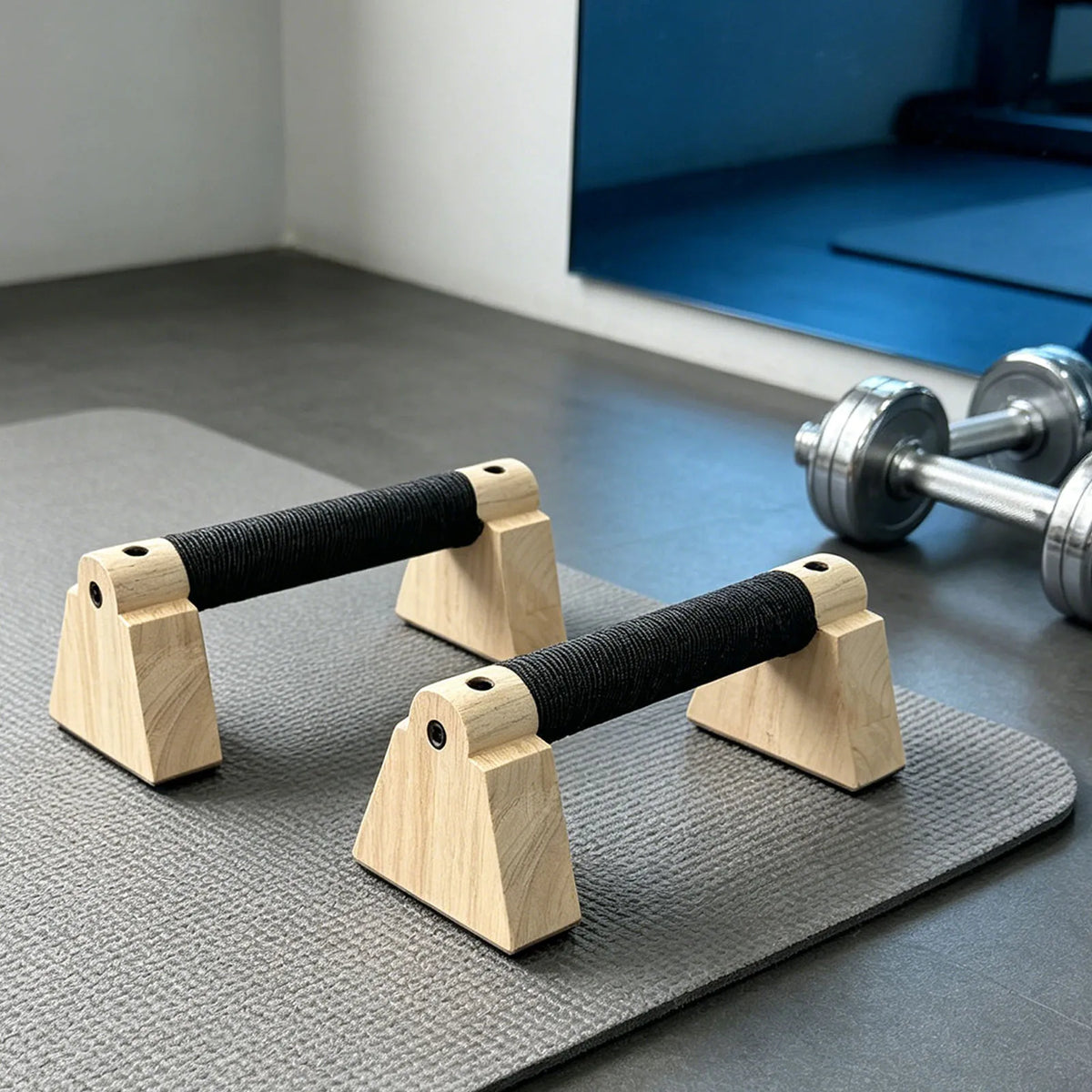 Set of wooden parallettes with black grip handles and stable arched wooden bases
