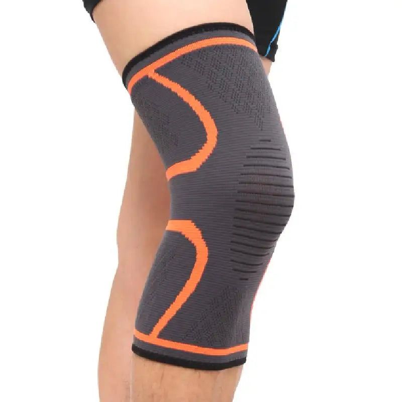 Black knee sleeve with orange contour bands and ribbed compression texture.