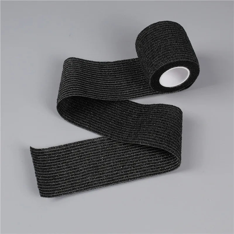 Black self-adhesive wrist bandage roll with circular white inner core