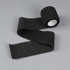 Black self-adhesive wrist bandage roll with circular white inner core