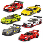 Assorted racing car model building blocks in red, green, yellow, white, and gray