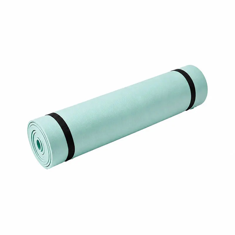 Foldable yoga mat in aquamarine, rolled cylinder with black end trim