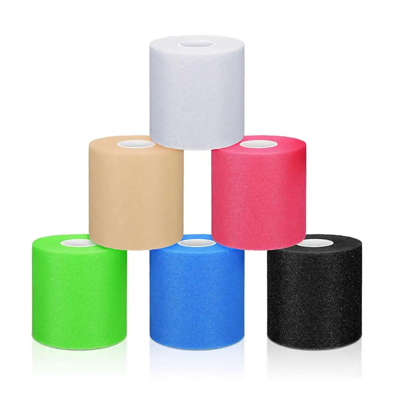 Foam underwrap tape rolls in white, tan, red, green, blue, and black with cores