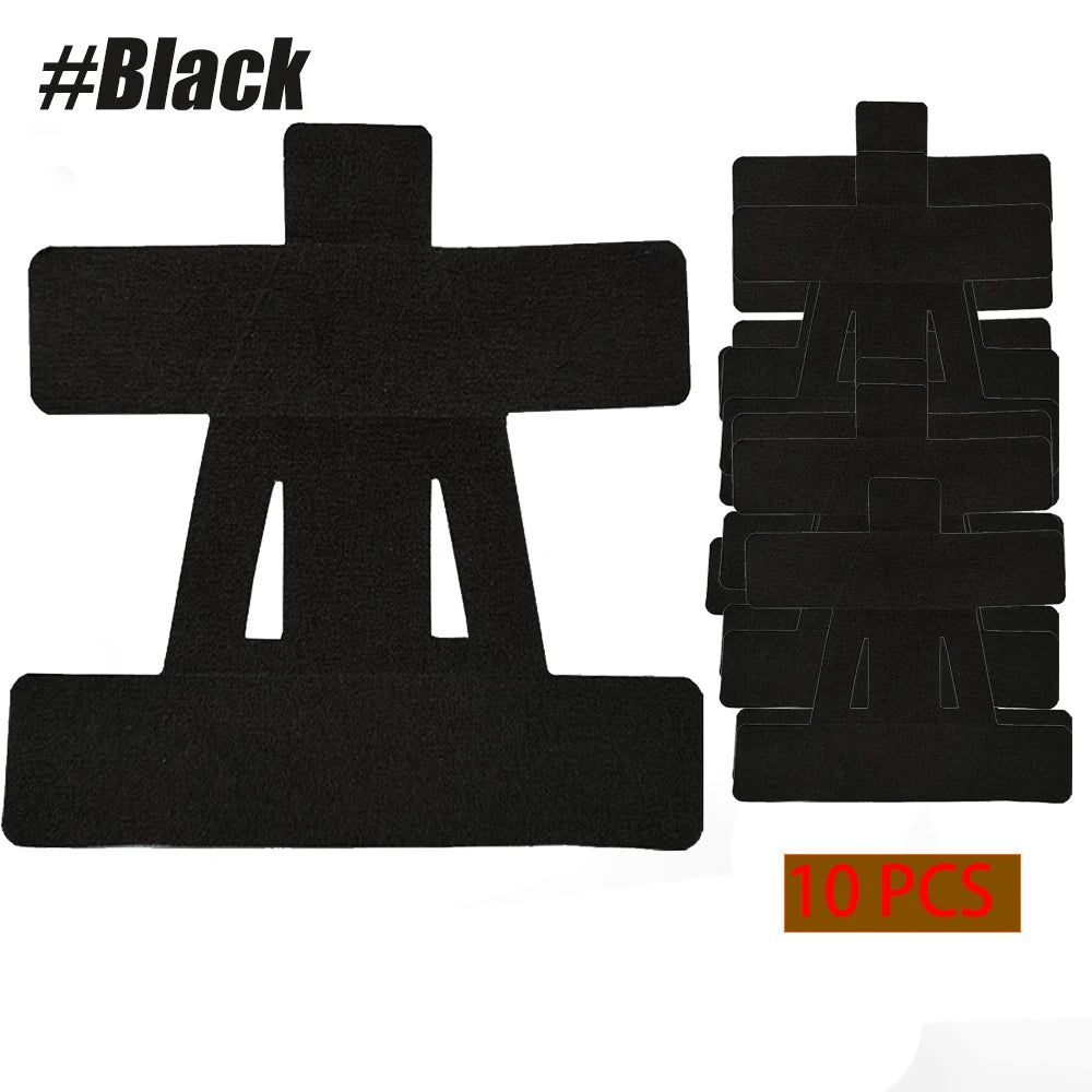Black kinesiology tape 10-pack with cross-shaped strips and stacked pieces