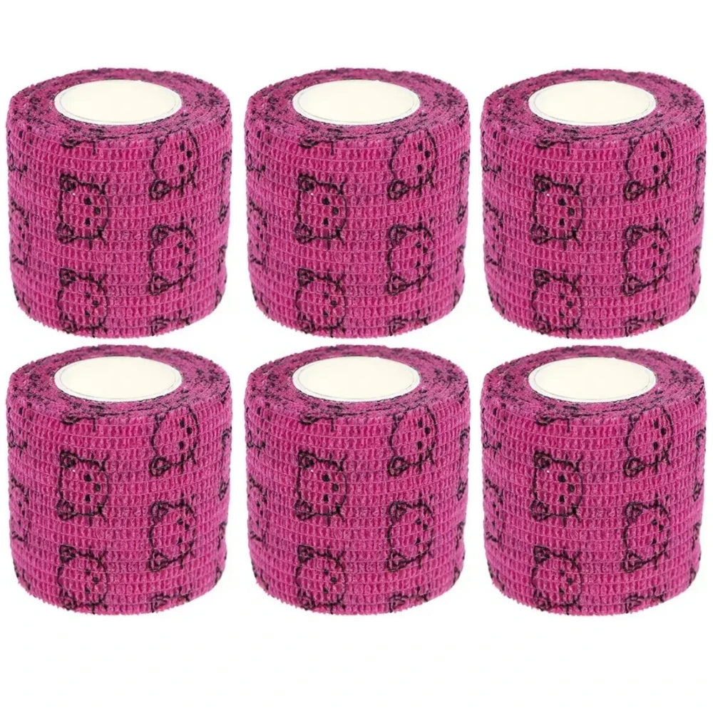Set of magenta-pink self-adhesive bandage rolls with dark animal icon pattern