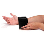 Black self-adhesive wrist bandage wrapped around a hand at the wrist