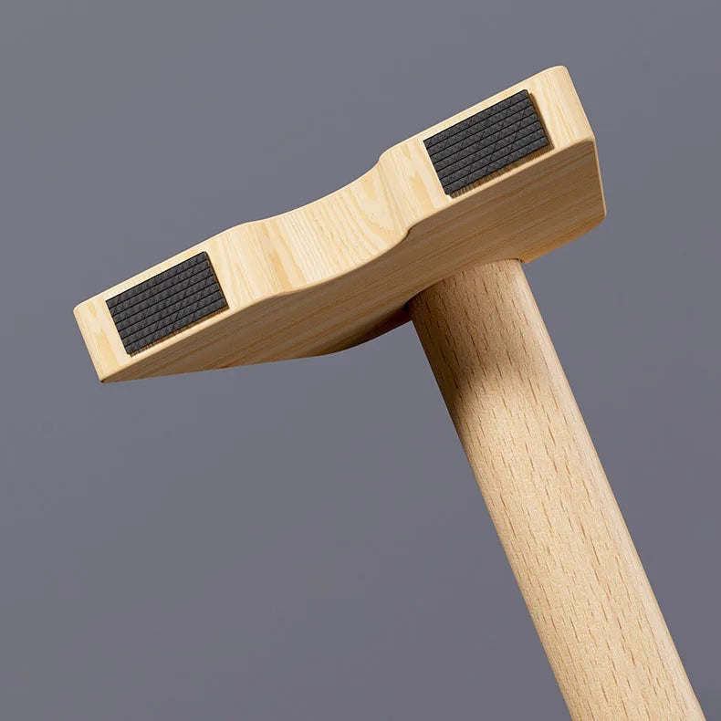 Single wooden parallettes bar with black grip pad on top and arched support base