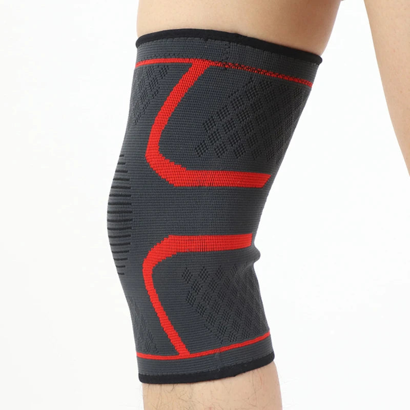 Black knee sleeve with red contour bands and textured grip pattern.