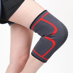 Black knee sleeve with blue U-shaped support bands and textured grip weave.