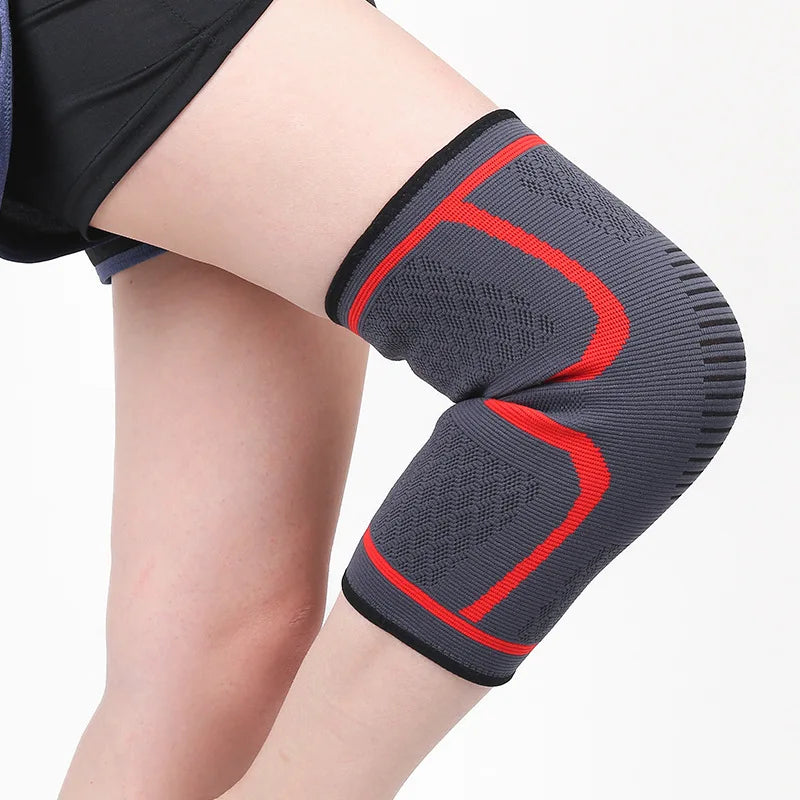 Black knee sleeve with blue U-shaped support bands and textured grip weave.