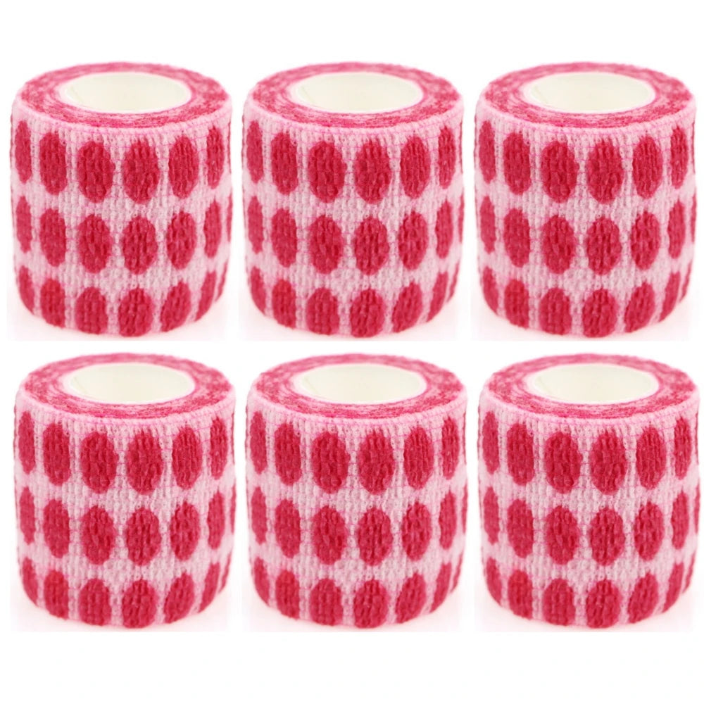 Set of white bandage rolls with red heart pattern and circular white inner cores