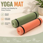 Olive green and orange yoga mats, both rolled cylinders with black edge bands