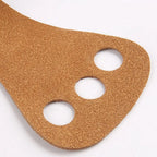 Aerial apparatus grip wraps pair, tan, close-up of three circular finger cutouts