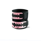 Pink wrist brace pair with black straps and pink graphic lettering, stacked