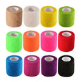 Assorted self-adhesive bandage rolls in assorted colors, each with white inner core