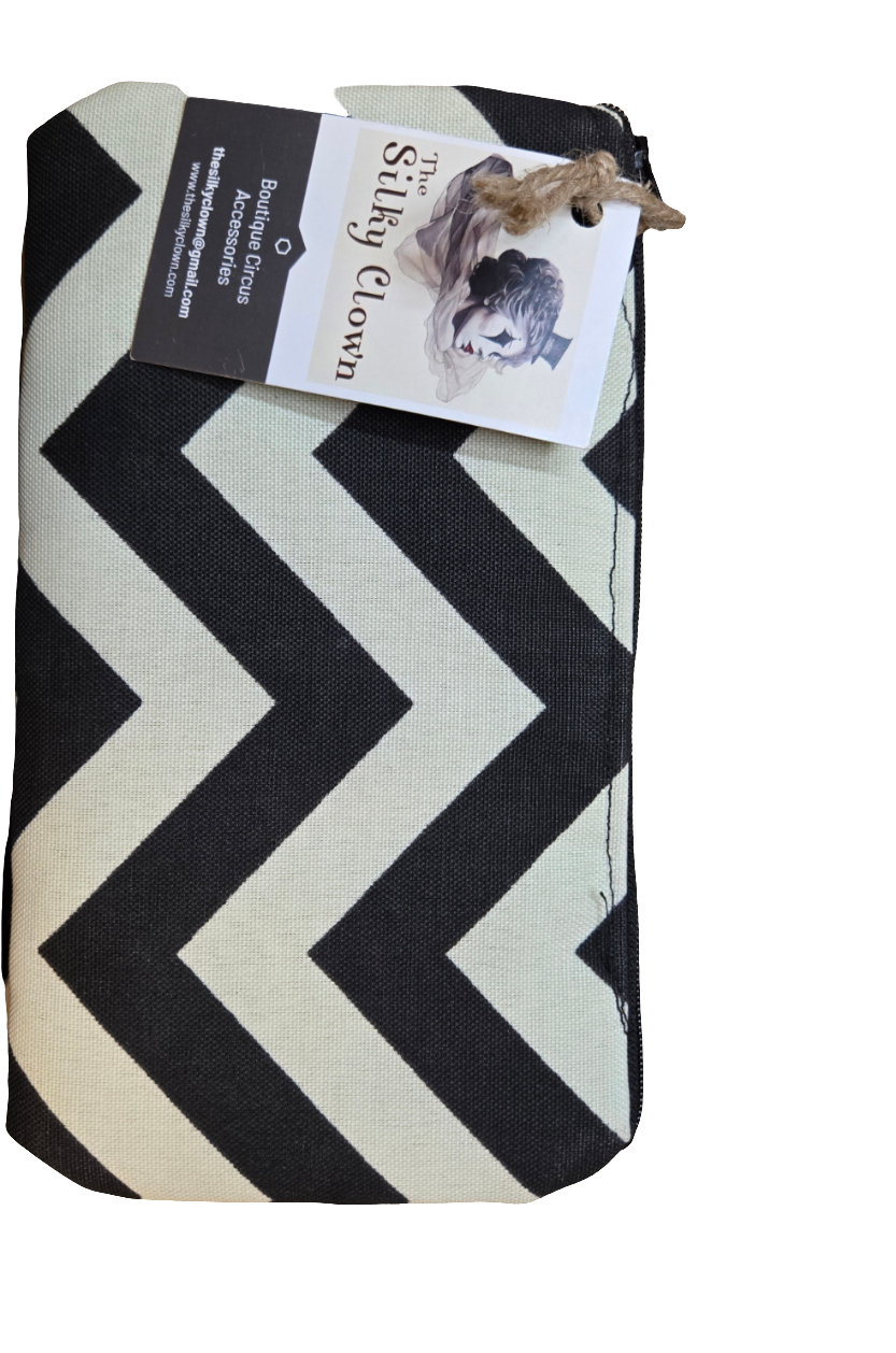 Handmade cloth gear bag with black chevron zigzag pattern and fabric handle pull