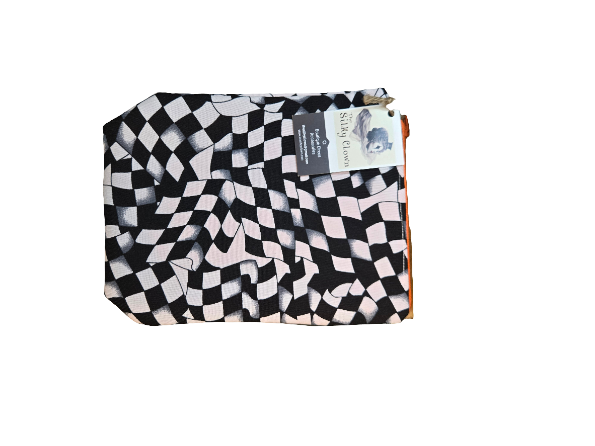 Handmade cloth gear bag with black-and-white checkered pattern and fabric handle tab