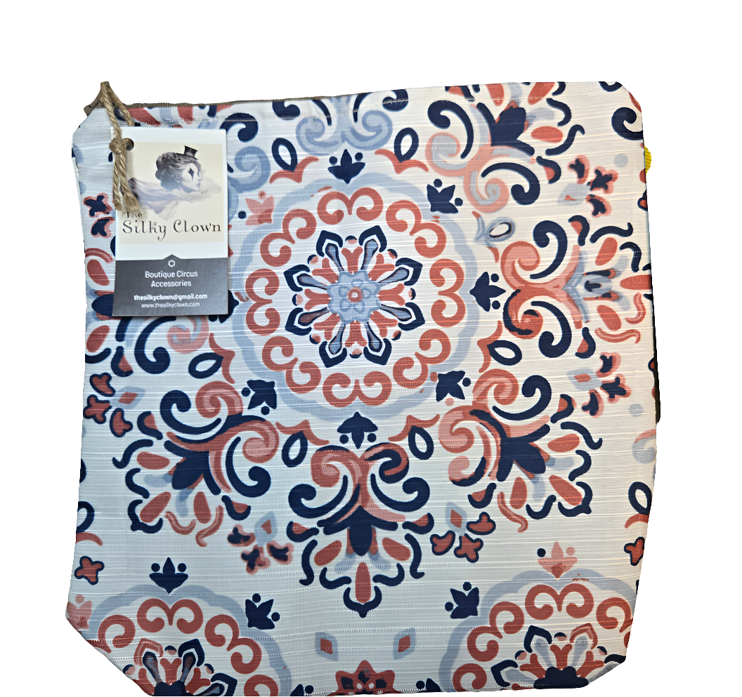 Handmade cloth gear bag with colorful floral scroll pattern and fabric handle tabs