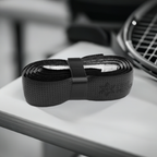 Black grip tape roll, perforated texture, black strap band