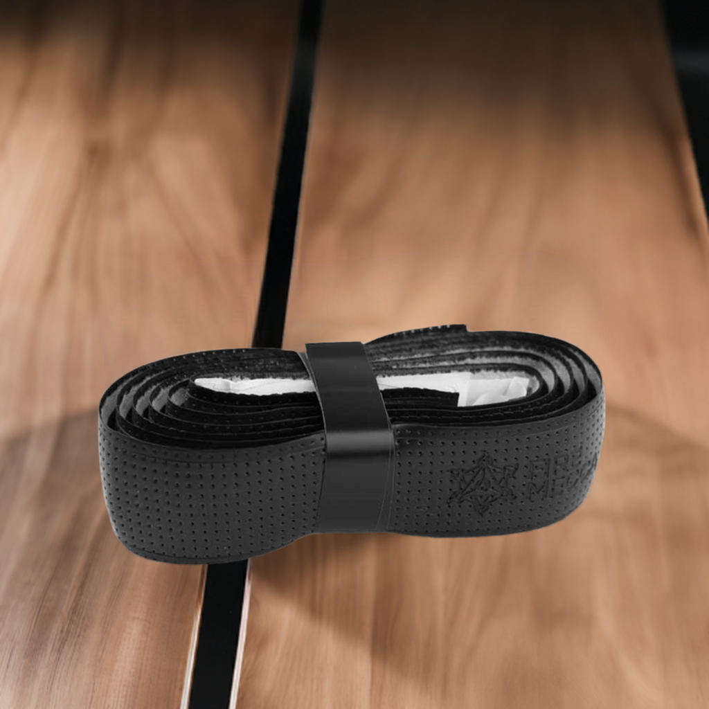 Black grip tape roll with perforated pattern and center wrap strap