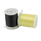 Two Kevlar thread spools in black and yellow with hanging thread strands